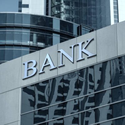 Bank sign on glass wall of business center